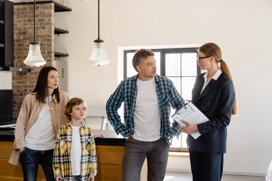 Contractor talking with a family in their home